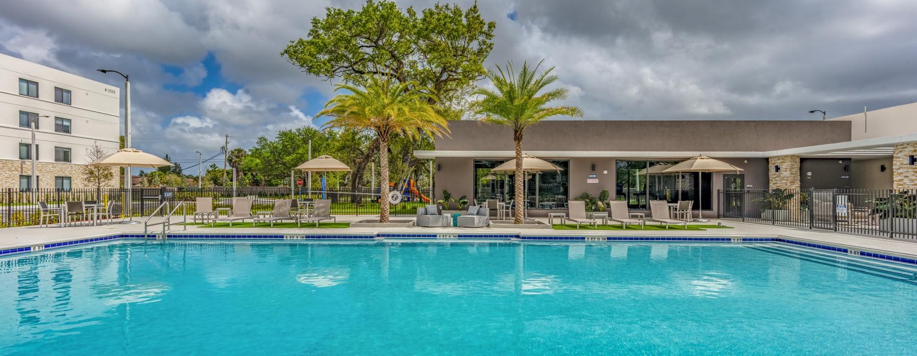 a pool with a building in the background