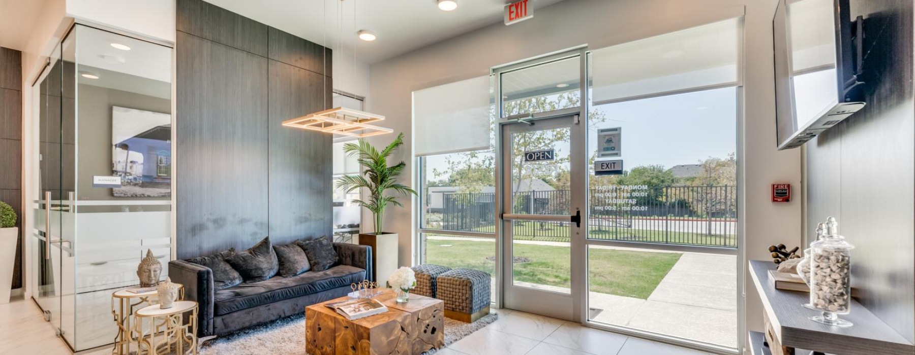 Entryway of a leasing office with modern seating and décor